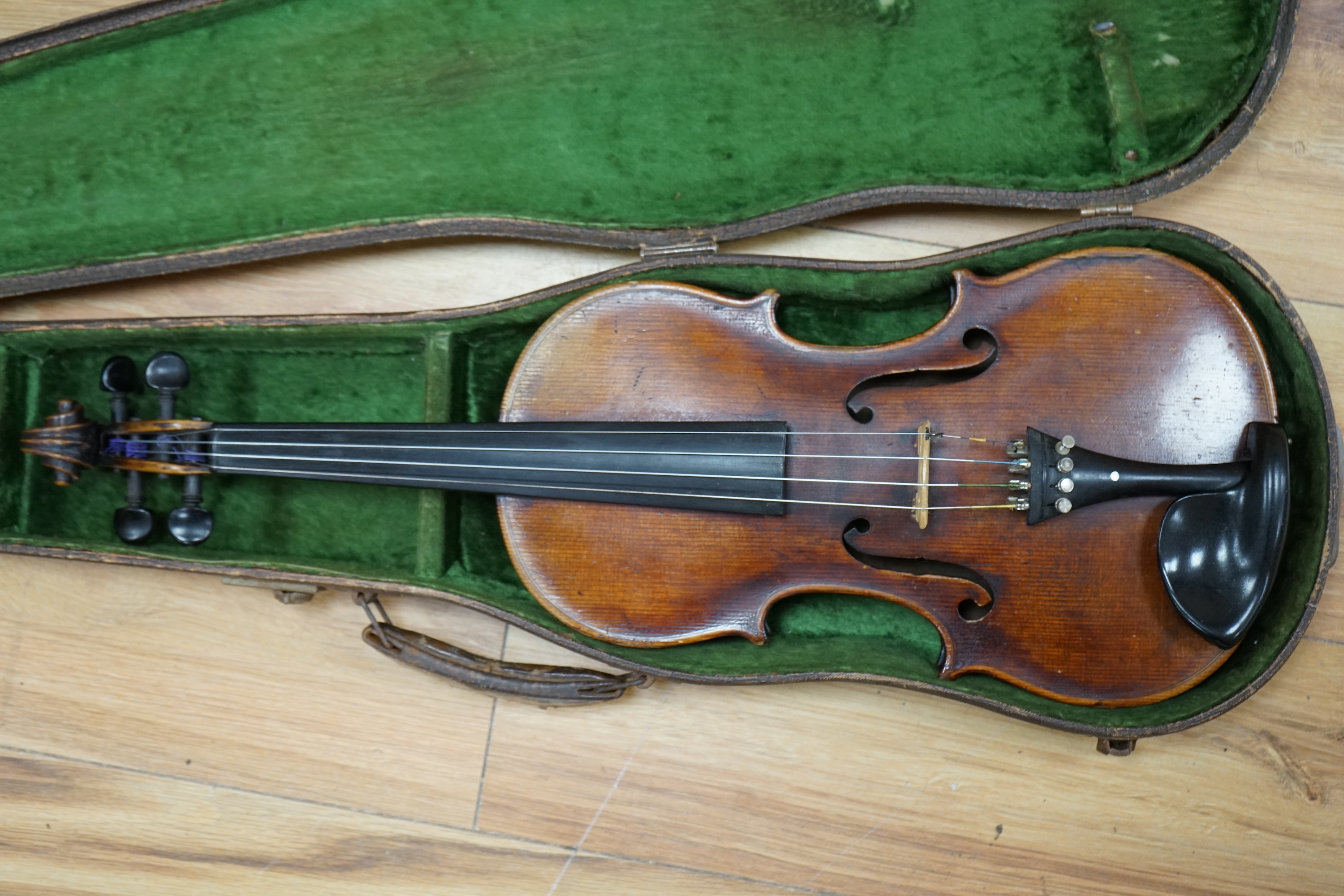 A cased 19th century English violin, with label reading George Craske, Fecit 1842, Edward Crompton, 54, Barton Arcade, Deansgate, Manchester, body length 36cm. Condition - fair to good.